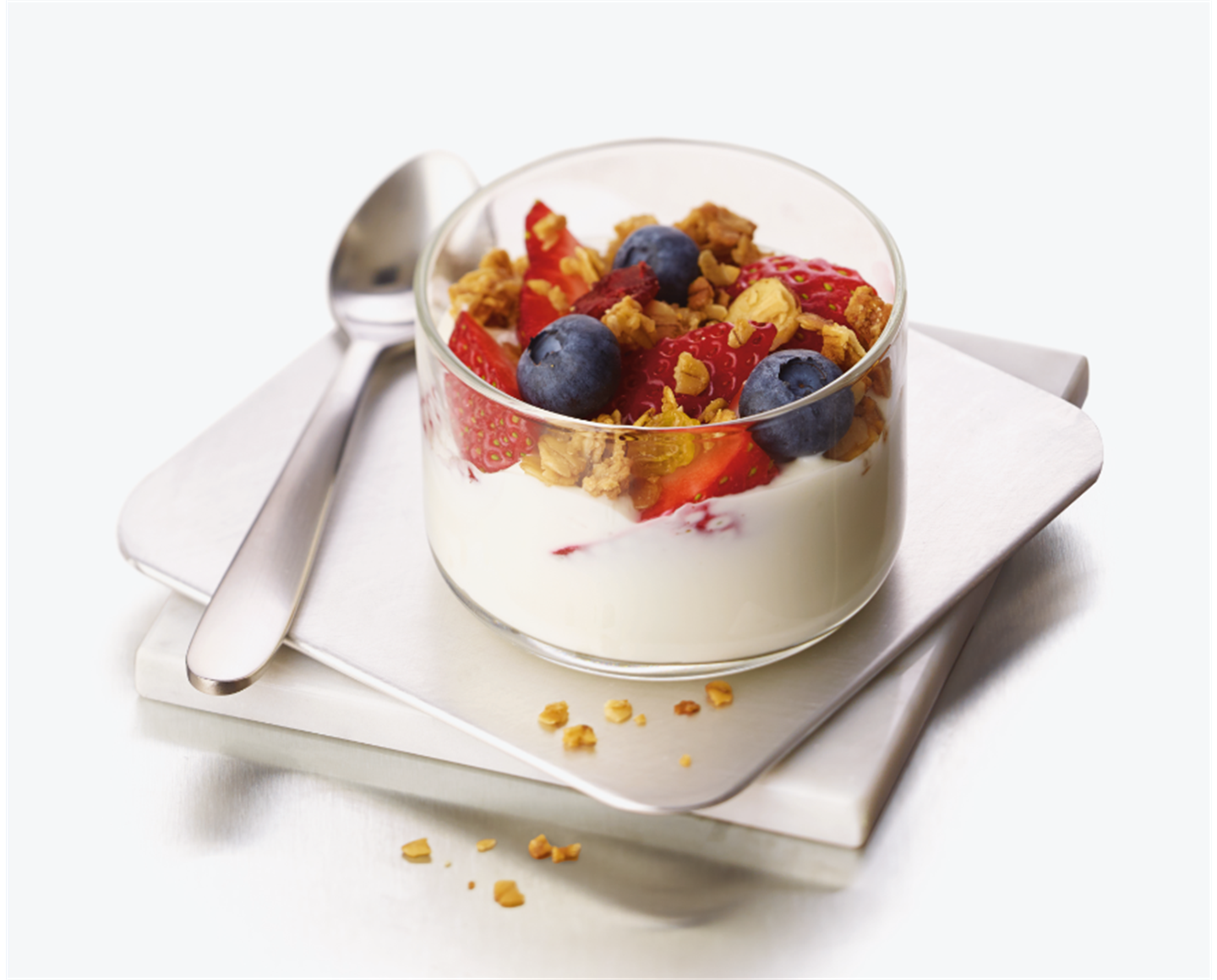 Greek yogurt parfait with fresh strawberries and blueberries topped with Chick-fil-A Harvest Nut Granola